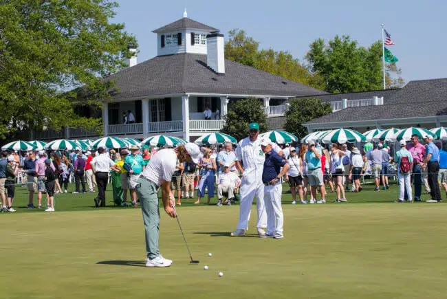 Visio Founder Phil Kenyon with Tommy Fleetwood on putting green at the Masters